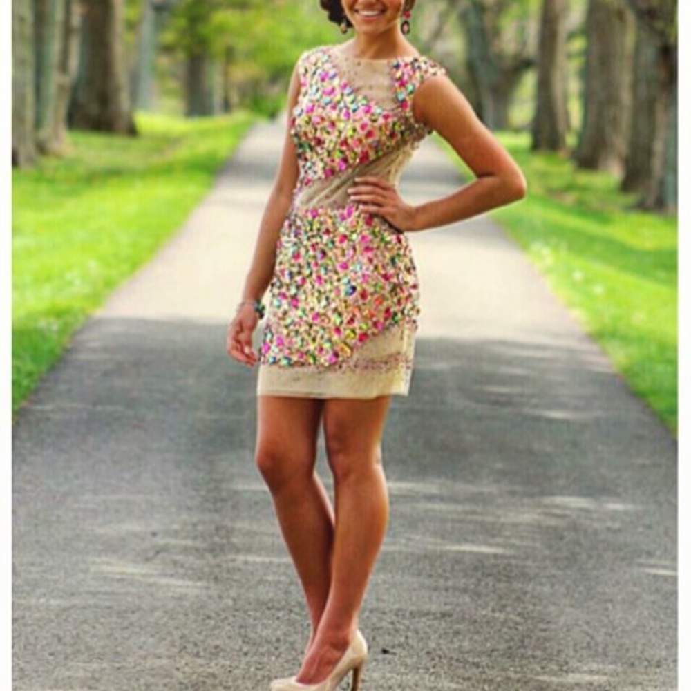 Dress originally $600. Bracelet $95, earrings $88